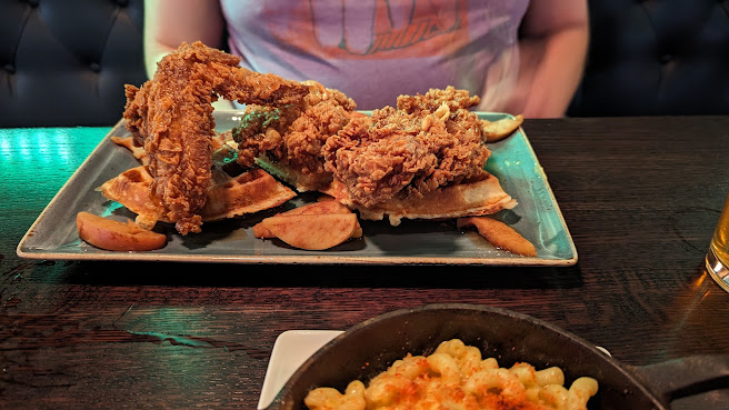 Handsome Hog signature dishes Chicken and Waffles, Shrimp and Grits, Pulled Pork, Beef Brisket, "Pork-of-the-Day"